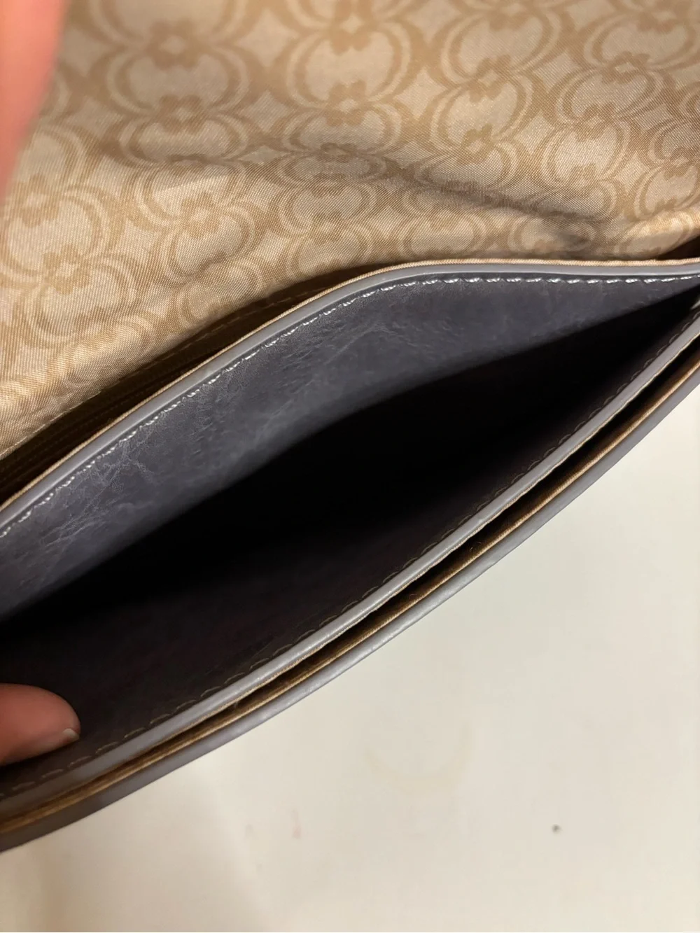 Stud-Trim Gray Wristlet Clutch